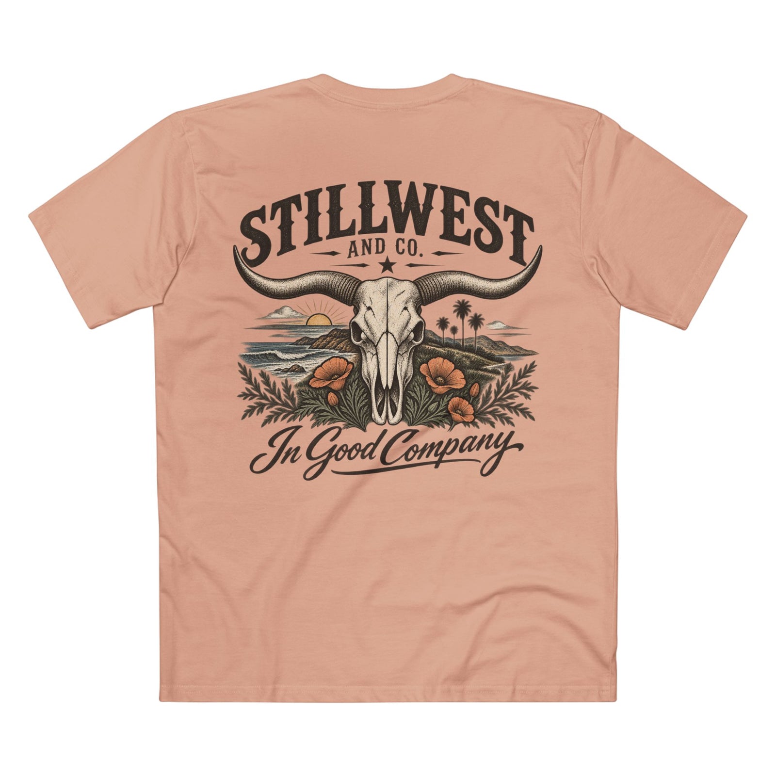 A peach-colored short-sleeve t-shirt shown from the back, featuring a large graphic print of a steer skull, a longhorn, desert scenery, and the text 'STILLWEST AND CO. In Good Company'.