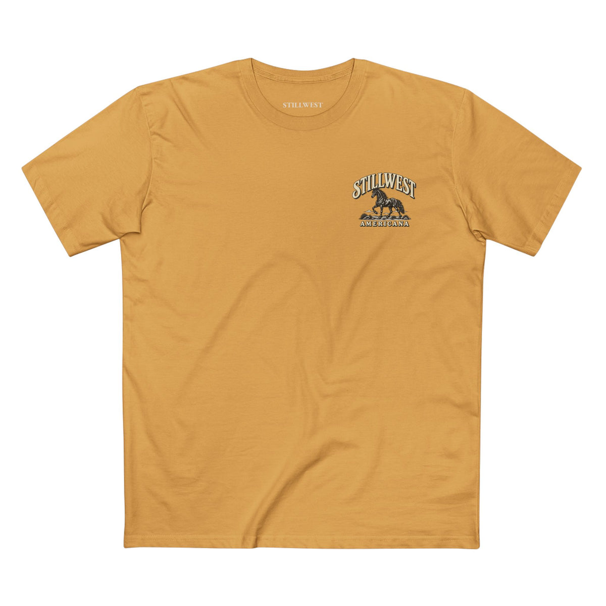 A mustard yellow crewneck t-shirt with a small dark graphic on the left chest featuring the text 'STILLWEST' and 'AMERICANA' with an illustration of a Mustang horse.