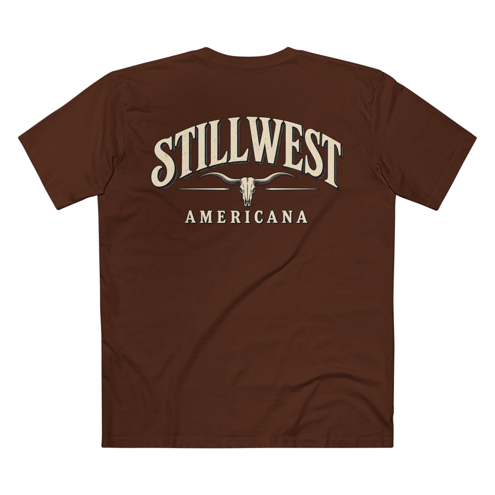 A brown short-sleeve t-shirt shown from the back, featuring a cream-colored graphic print that reads 'STILLWEST AMERICANA' with a longhorn skull design in the center.