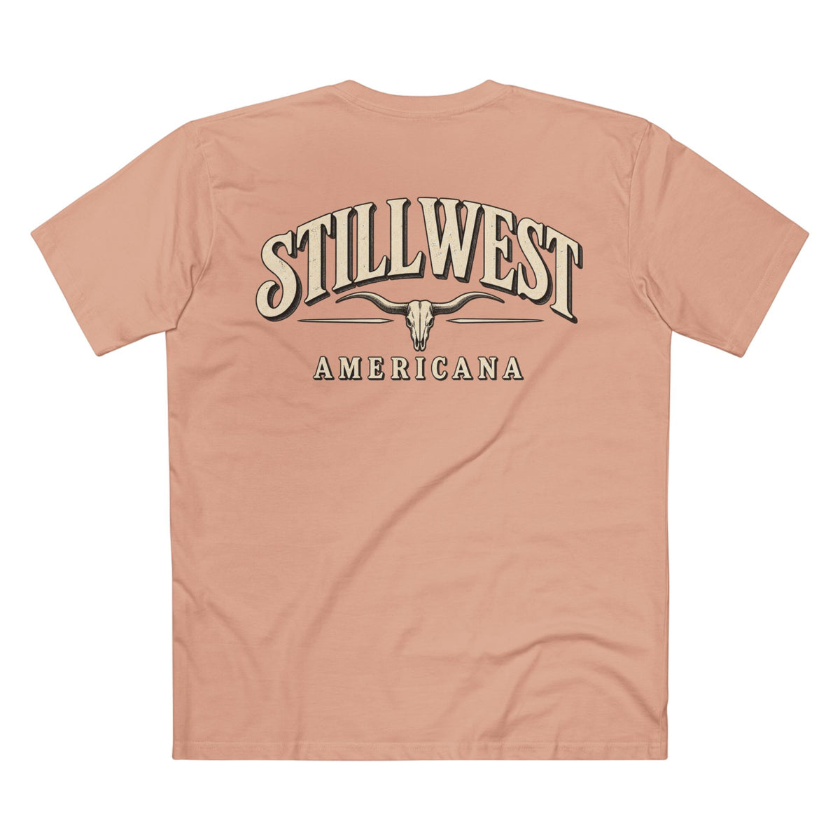 A peach-colored short-sleeve t-shirt shown from the back, featuring a large graphic print with the words 'STILLWEST AMERICANA' and a longhorn skull design in beige and dark brown.