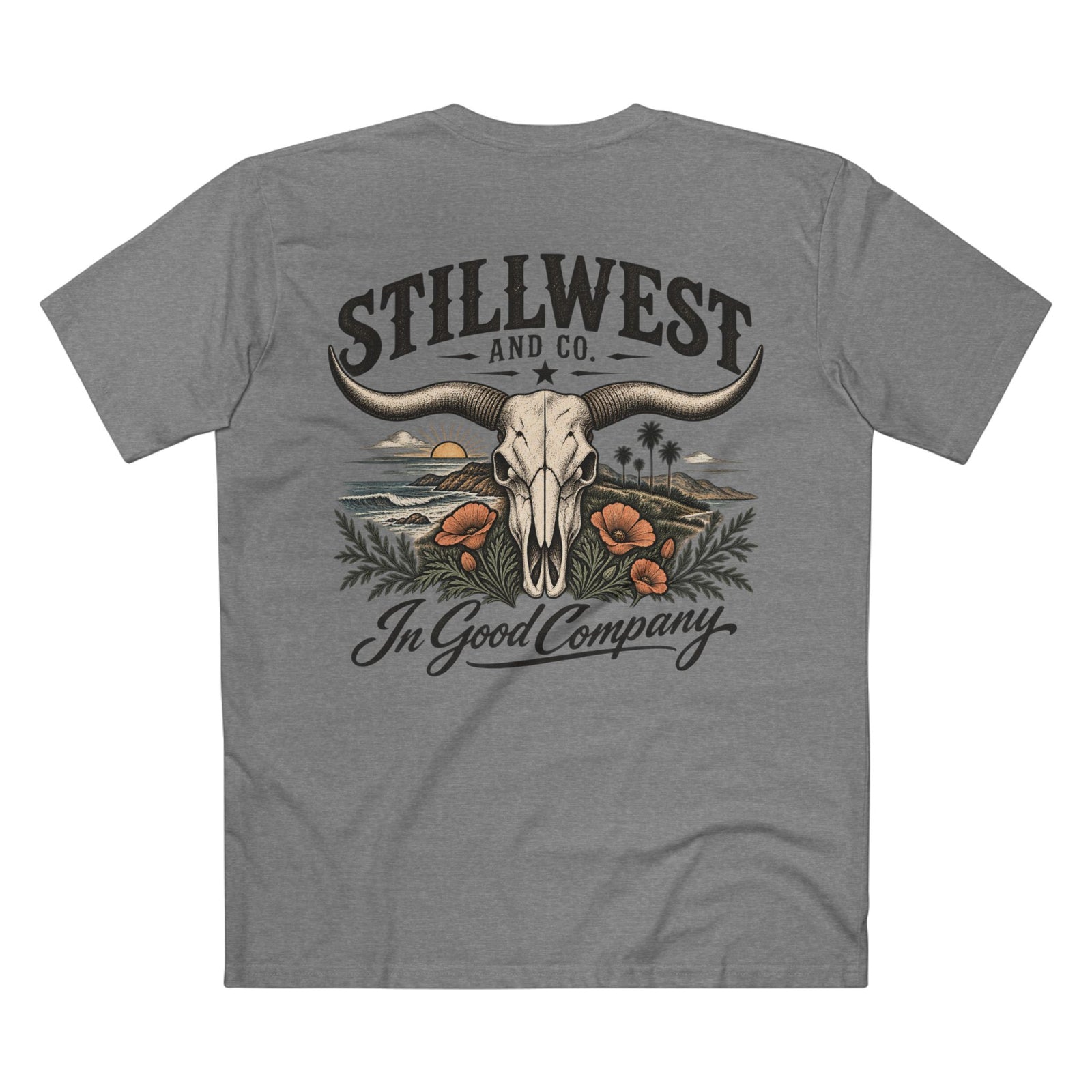 A heather gray short-sleeve t-shirt shown from the back, featuring a large graphic print of a steer skull with long horns, desert scenery, orange poppies, and the text 'STILLWEST AND CO.' and 'In Good Company'.