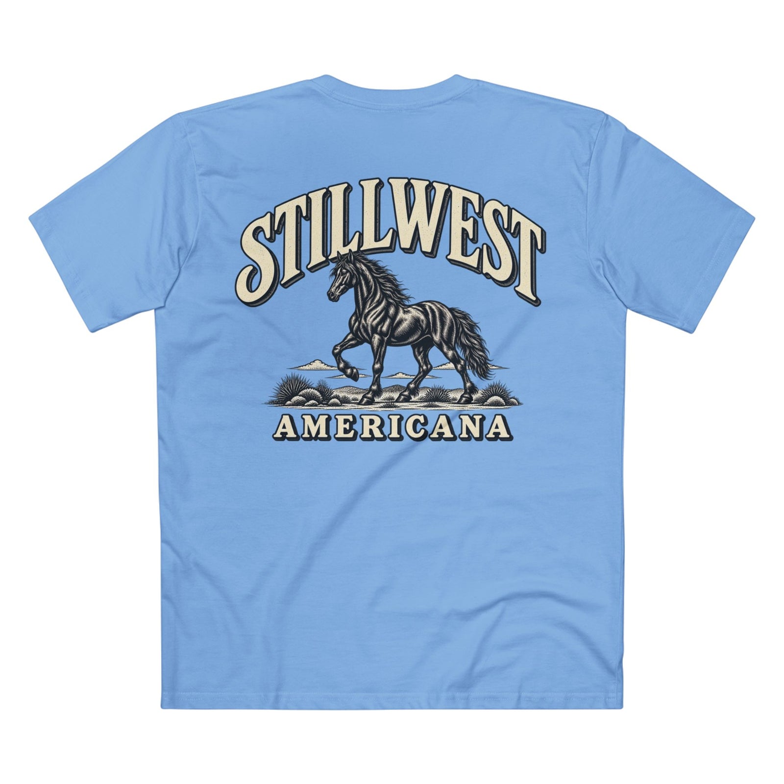 A light blue short-sleeve t-shirt shown from the back, featuring a large graphic print of a black horse with the text 'STILLWEST AMERICANA' in cream and dark blue.