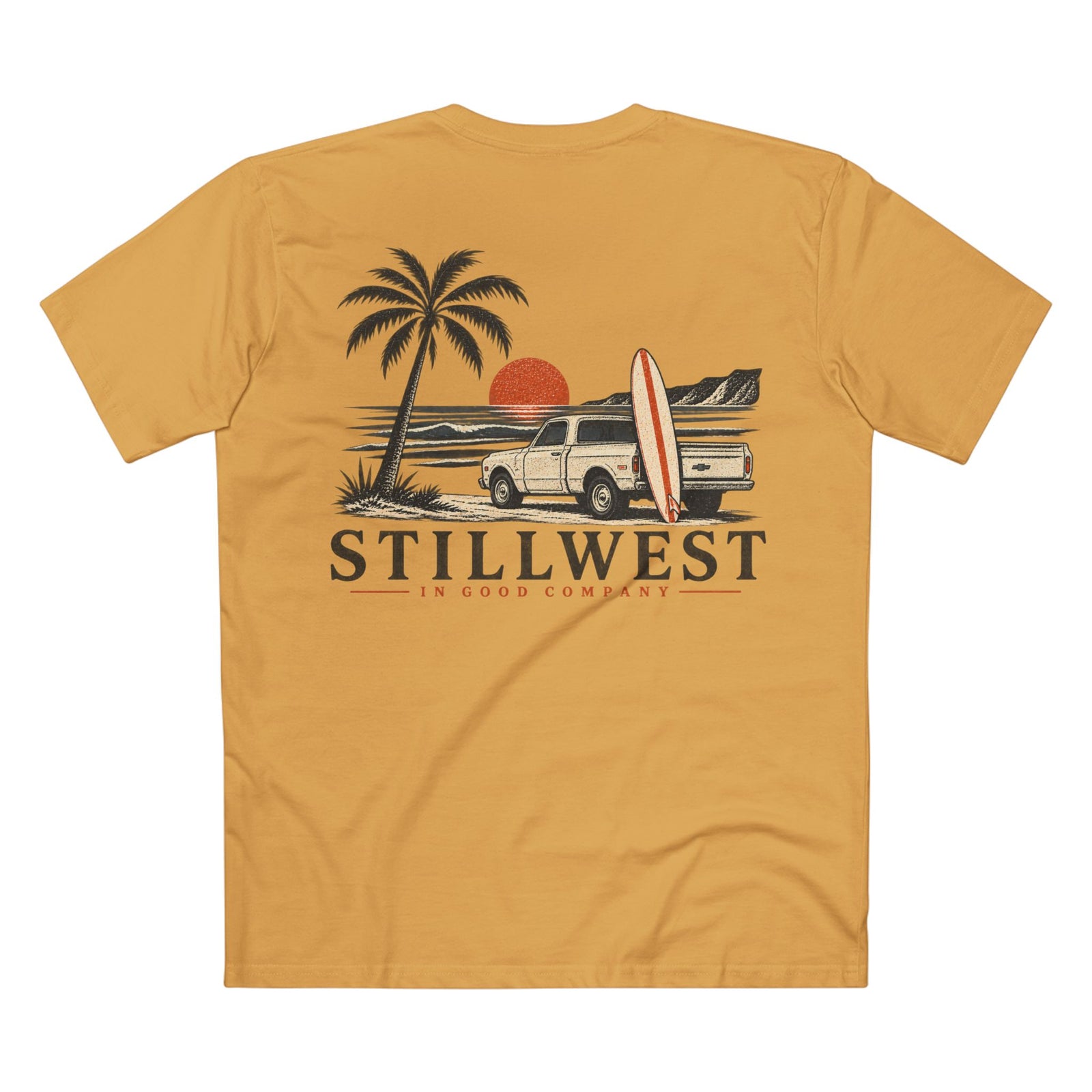 A mustard yellow short-sleeve t-shirt shown from the back, featuring a retro graphic of a palm tree, pickup truck, surfboard, and sunset with the text 'STILLWEST IN GOOD COMPANY'.