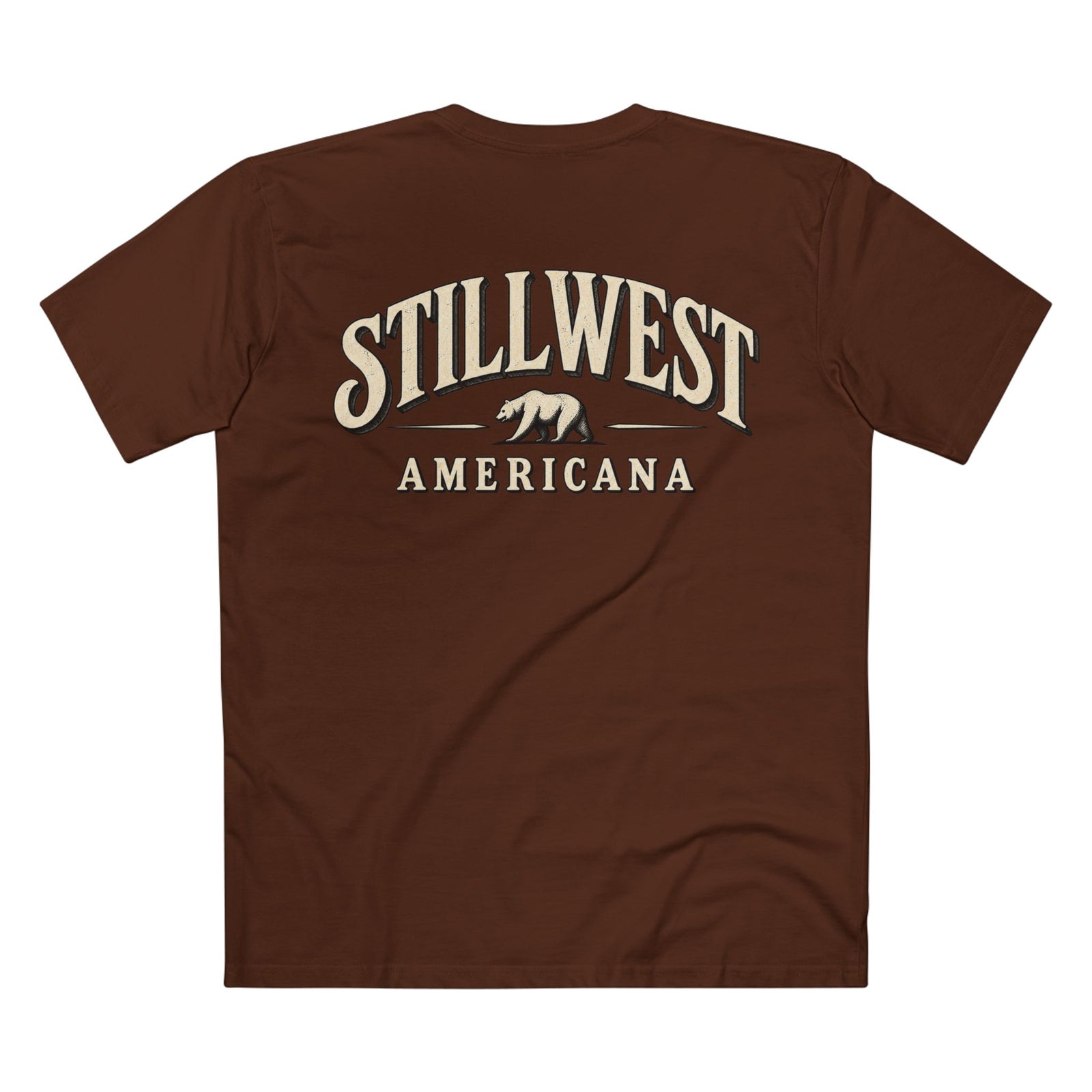 A brown short-sleeve t-shirt shown from the back, featuring a distressed cream-colored graphic print that reads 'STILLWEST AMERICANA' with a bear silhouette in the center.
