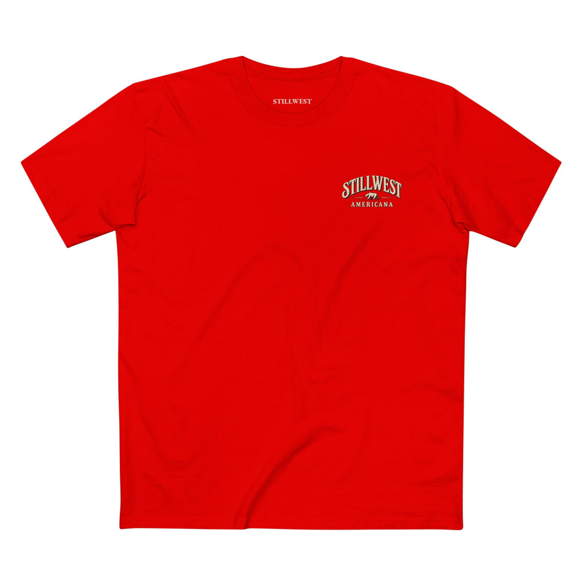 A red t shirt with the words stillwest americana and a bear illustration on the front.