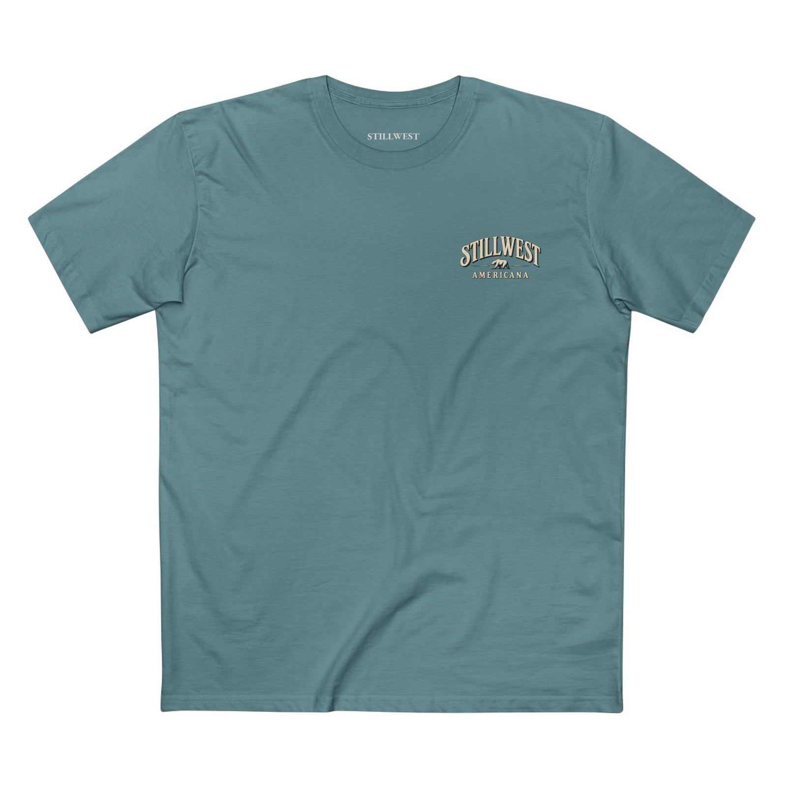 A teal blue t shirt with the words stillwest americana and a bear illustration on the front.