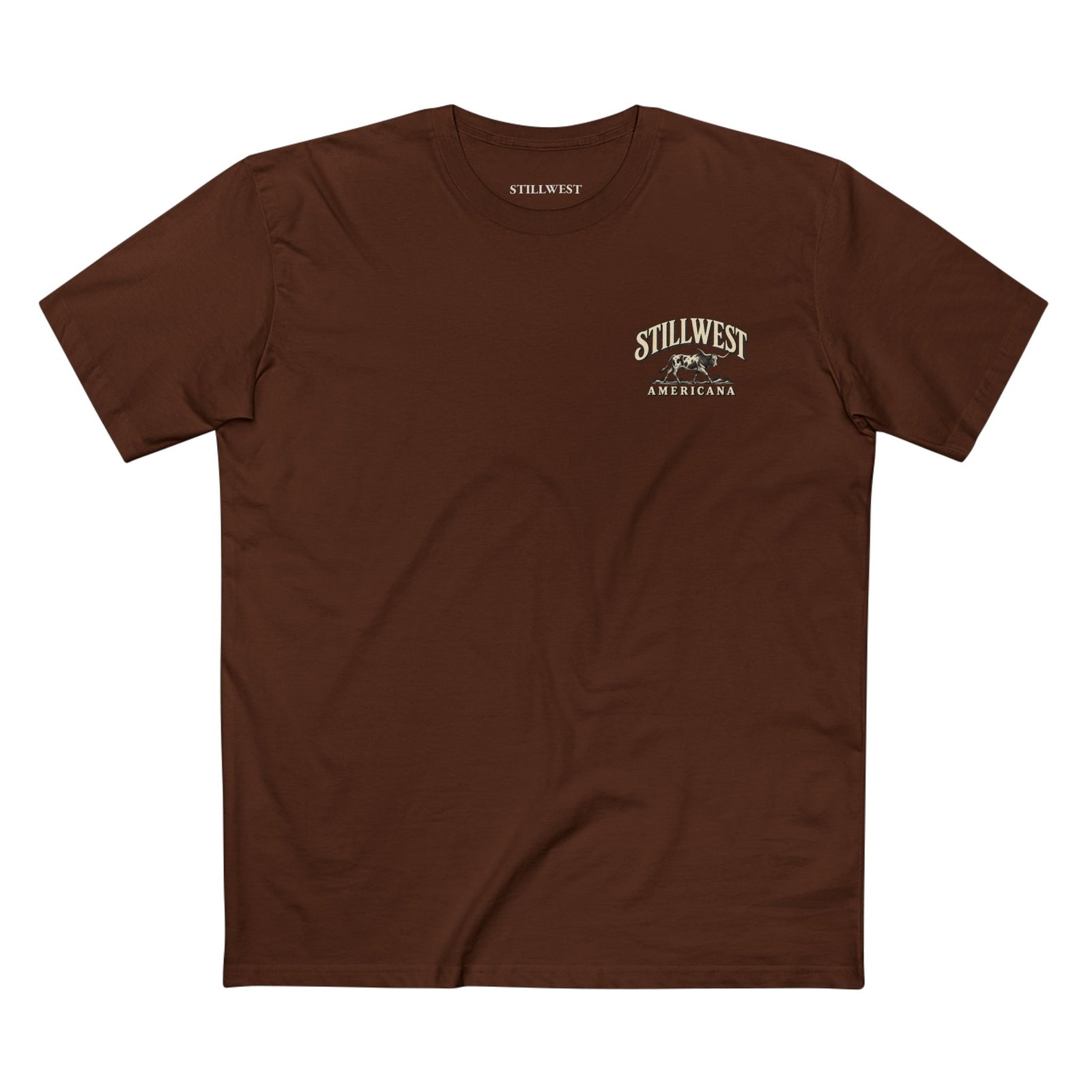A brown short-sleeve crewneck t-shirt with a small vintage-style 'Still West Americana' graphic printed on the left chest, displayed flat against a solid white background.