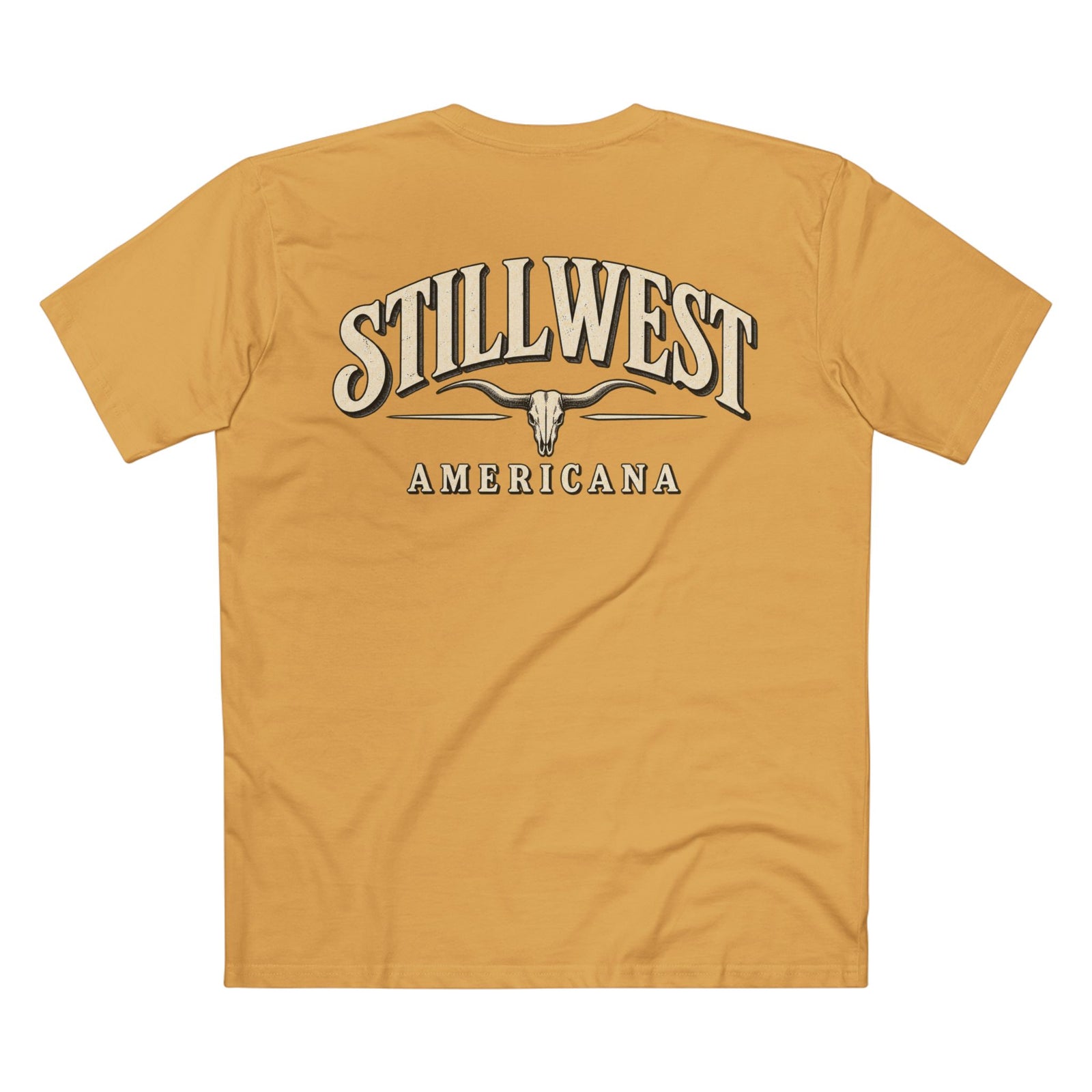 A mustard yellow t-shirt shown from the back, featuring a large graphic print with the words 'STILLWEST AMERICANA' and a longhorn skull design in cream and dark brown.